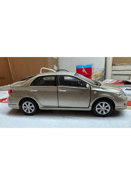 Oyuncak Metal Model Araba 1/36 Çek Bırak 2009 Toyota Corolla Açık Kahve fiyatları