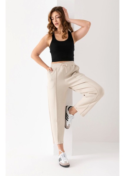 Kadın Bej Renk Beli Lastikli Modal Kumaş Çımalı Bilek Pantolon Yumuşak Dokulu Şık Bağcıklı Pantolon modelleri