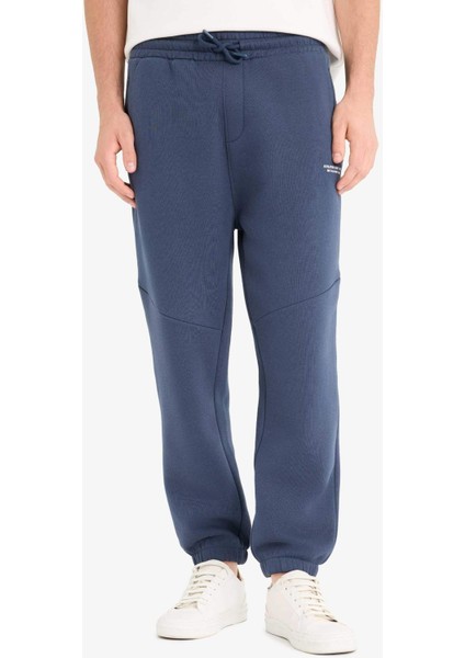 Regular Fit Beli Bağcıklı İçi Yumuşak Tüylü Paçası Lastikli Baskılı Fermuar Cepli Eşofman Altı fırsatları