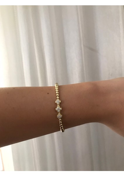 Taşlı Bombeli Gold Kadın Kelepçe – Zarif, Şık ve Işıltılı Takı Modeli