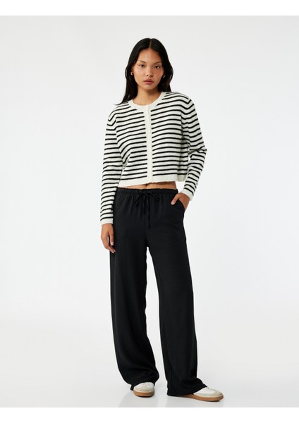 Rahat Kalıp Cep Detaylı Beli Bağcıklı Aerobin Kumaş Geniş Paça Pantolon