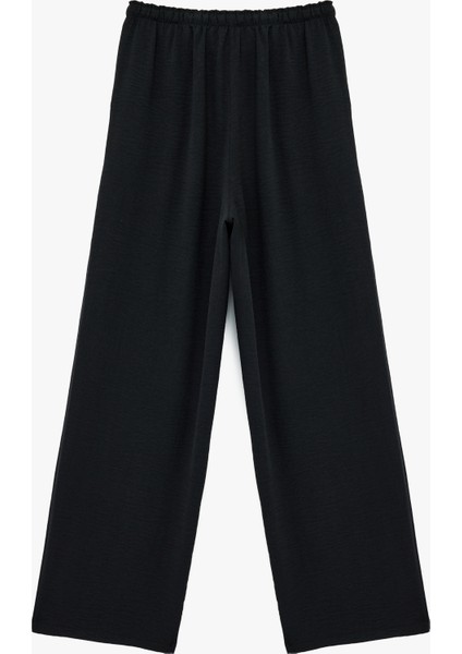 Rahat Kalıp Cep Detaylı Beli Bağcıklı Aerobin Kumaş Geniş Paça Pantolon fırsatları