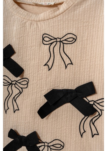 Kız Çocuk Pamuklu Bej Fiyonk Desenli Sweatshirt ve Siyah Pantolon Takım – Şık ve Rahat Kombin modelleri