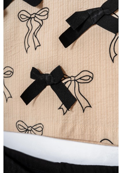 Kız Çocuk Pamuklu Bej Fiyonk Desenli Sweatshirt ve Siyah Pantolon Takım – Şık ve Rahat Kombin fırsatları