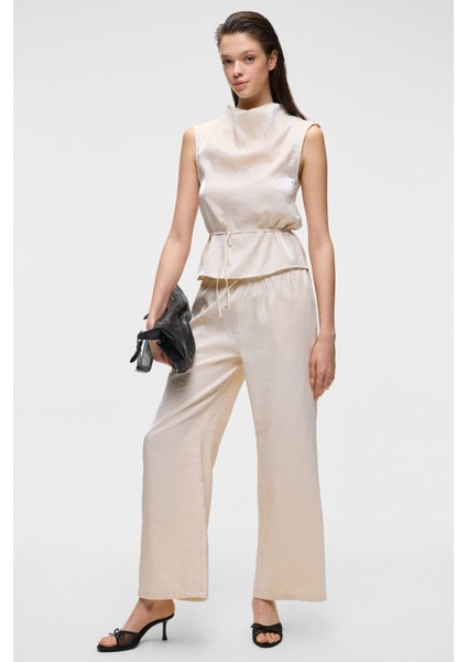 UBANITY Kadın Parlak Kumaşlı Geniş Paçalı Saten Görünümlü Ekru Pantolon fiyatları