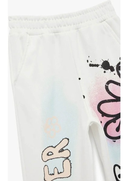 Şardonlu Beli Lastikli Baskılı Jogger Ekru Kız Çocuk Eşofman Altı 6WKG40049AK modelleri