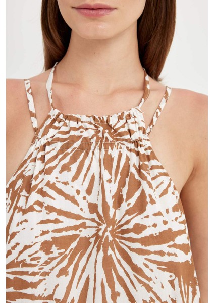 A Kesim Halter Yaka Çiçek Desenli Vual Kolsuz Maxi Elbise