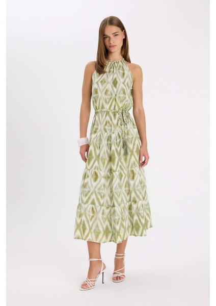 A Kesim Halter Yaka Desenli Krinkıl Kumaş Kemerli Kolsuz Maxi Abiye Elbise