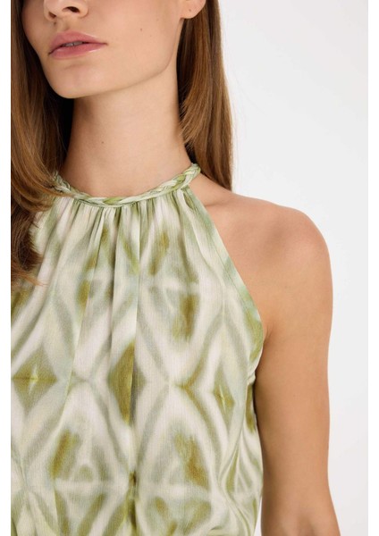 A Kesim Halter Yaka Desenli Krinkıl Kumaş Kemerli Kolsuz Maxi Abiye Elbise