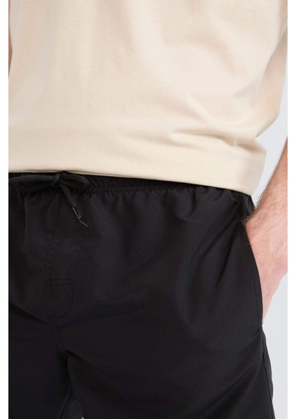 Regular Fit Kısa Boy Cepli File Astarlı Beli Bağcıklı Düz Hafif Kumaş Deniz Şortu E5133AXNS