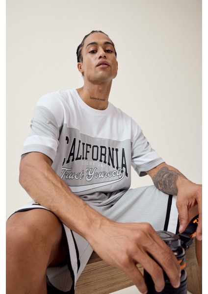 Fit Hızlı Kuruyan Oversize Geniş Kalıp Bisiklet Yaka Baskılı Sporcu Kısa Kollu Tişört E4122AX25SM