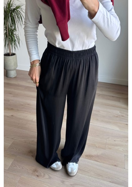 Siyah Beli Lastikli Bol Paça Dökümlü Saten Pantolon fırsatları