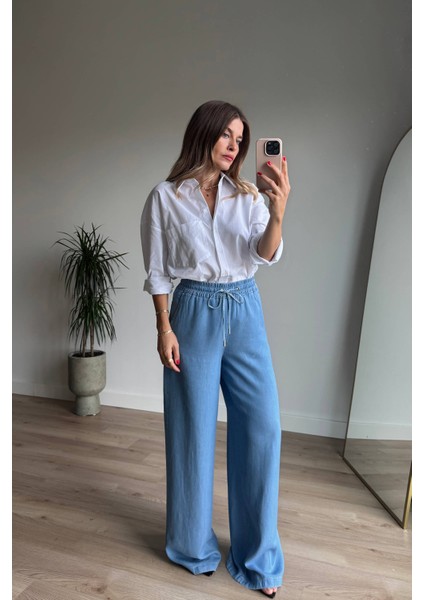 Mavi Beli Lastikli Bol Paça Salaş Model Ince Kot Pantolon indirimleri
