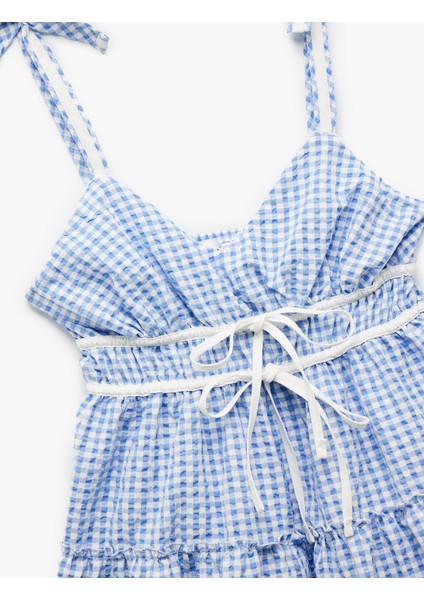 Kolsuz V Yaka Fiyonklu Bağcıklı Pötikareli Mini Elbise indirimleri