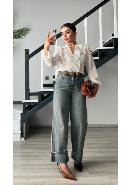 Mavi Tintli Paça Katlama Detaylı Jean indirimleri