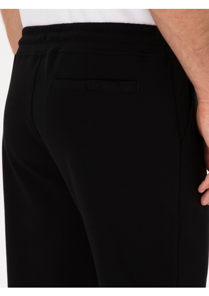 Erkek Siyah Slim Fit Pamuk Karışımlı Paçası Lastikli Eşofman Altı 50311677-VR046