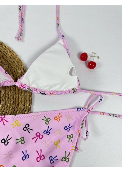 Pembe Renkli Fiyonk Desenli Boyundan Bağlamalı Şık Üçgen Bikini Takımı indirimleri
