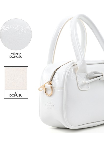 Kırışık Dokulu Beyaz SHK217 Fiyonklu Suni Deri, Tek Bölmeli, Fermuarlı,kolon Askılı, El, Kol ve Omuz Çantası indirimleri