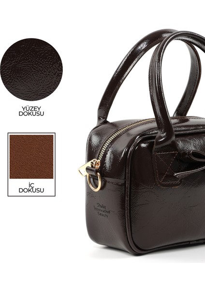 Kırışık Dokulu Kahverengi SHK217 Fiyonklu Suni Deri, Tek Bölmeli, Fermuarlı,kolon Askılı, El, Kol ve Omuz Çantası indirimleri