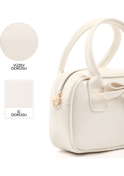 Kırışık Dokulu Krem SHK217 Fiyonklu Suni Deri, Tek Bölmeli, Fermuarlı,kolon Askılı, El, Kol ve Omuz Çantası indirimleri