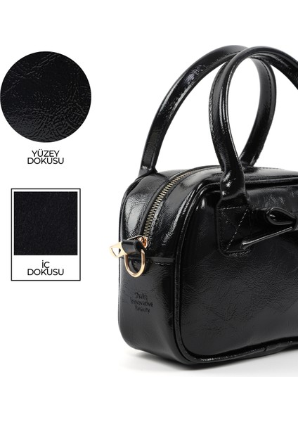 Kırışık Dokulu Siyah SHK217 Fiyonklu Suni Deri, Tek Bölmeli, Fermuarlı,kolon Askılı, El, Kol ve Omuz Çantası indirimleri
