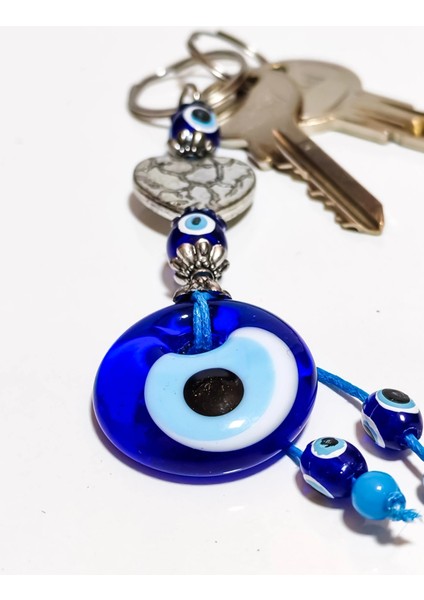 Gümüş Renkli Metal Kalp ve Mavi Cam Nazar Boncuklu Anahtarlık fırsatları