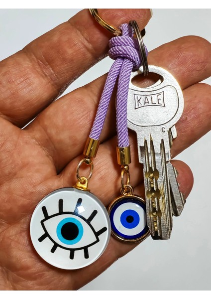 Göz Desenli Beyaz Cam Boncuk ve Küçük Sarı Metal Nazar Boncuklu Anahtarlık indirimleri
