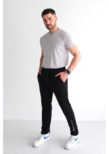 Erkek Beli Bağcıklı Slim Fit Slim Fit Cepli Düz Paça Baskılı Siyah Eşofman Altı fiyatları