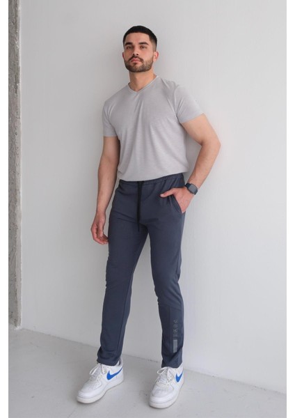 Erkek Beli Bağcıklı Slim Fit Slim Fit Cepli Düz Paça Baskılı Füme Eşofman Altı fırsatları