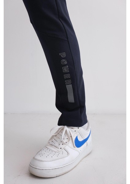 Erkek Beli Bağcıklı Slim Fit Slim Fit Cepli Düz Paça Baskılı Lacivert Eşofman Altı modelleri