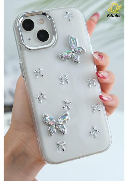 Apple iPhone 13 - 14 - 15 Kılıf Simli Fiyonk ve Kelebek Desenli Gümüş Kamera Çıkıntılı Parlak Kapak