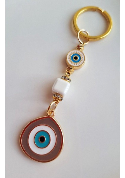 Hediyelik Zirkon Taşlı Bej Rengi Nazar Boncuklu Anahtarlık modelleri