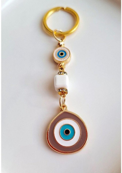 Hediyelik Zirkon Taşlı Bej Rengi Nazar Boncuklu Anahtarlık fırsatları