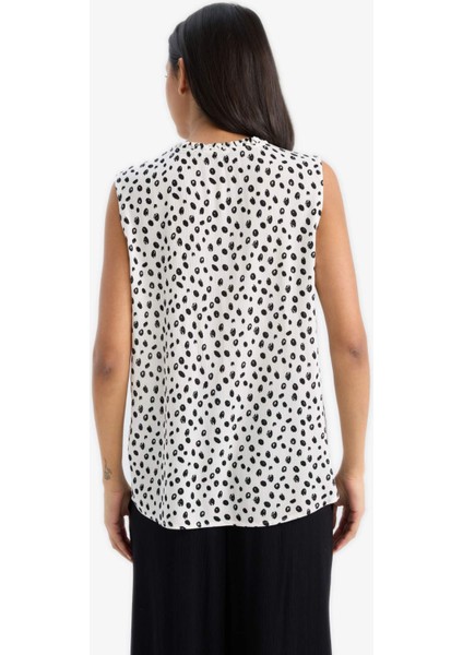 Regular Fit Puantiyeli Krinkıl Kumaş Kolsuz Bluz C1003AX25SM indirimleri