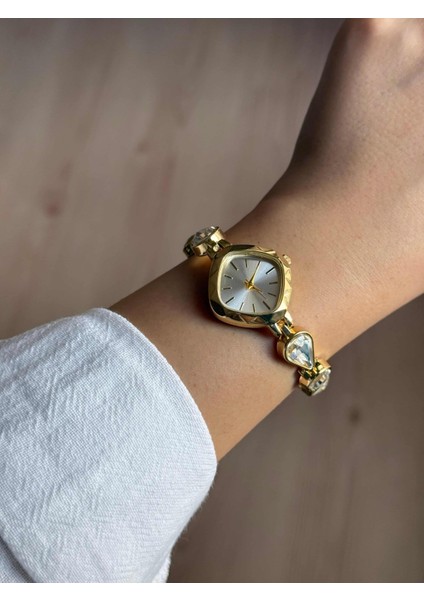 Beyaz Damla Taşlı Kordon Altın Renk Çelik Kadın Kol Saati -55 modelleri