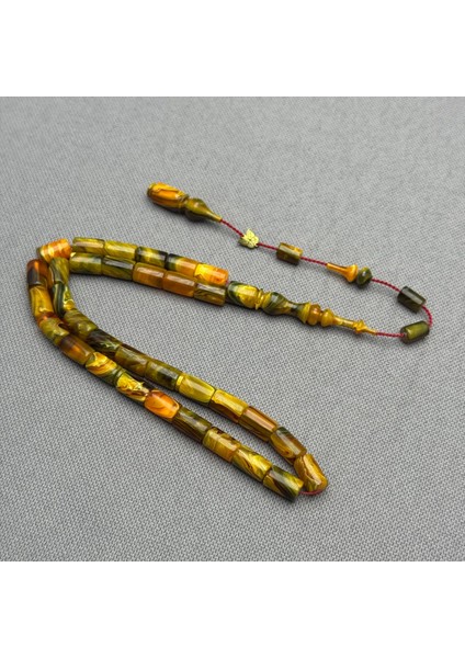 Emine Reşvani Usta Işçilikli Kesme Model Yoğun Hareli Yeşil Turuncu Sıkma Kehribar Tespih indirimleri