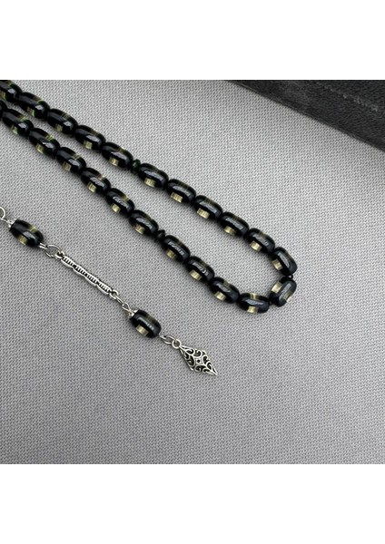 Alpaka Püsküllü Şeffaf Siyah Sürmeli Sıkma Kehribar Tespih fiyatları