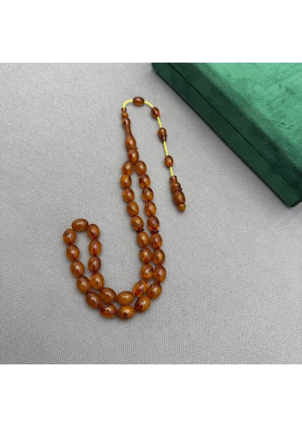 Bülbül Atölye Yoğun Hareli Damarlı Sıkma Kehribar Tespih fırsatları