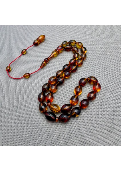 Usta Işçilikli Sarı Kırmızı Renk Geçili Hareli Sıkma Kehribar Tespih