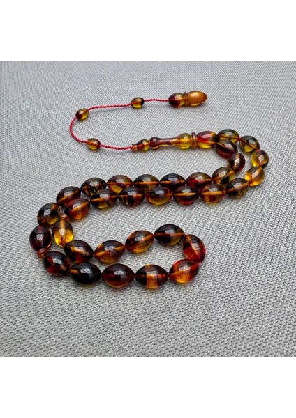 Usta Işçilikli Sarı Kırmızı Renk Geçili Hareli Sıkma Kehribar Tespih fiyatları