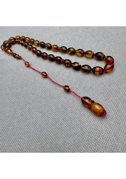 Usta Işçilikli Sarı Kırmızı Renk Geçili Hareli Sıkma Kehribar Tespih modelleri