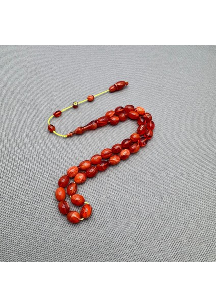 Ahmet Eryılmaz Usta Işçilikli Mercan Renkli Yoğun Hareli Sıkma Kehribar Tespih fiyatları