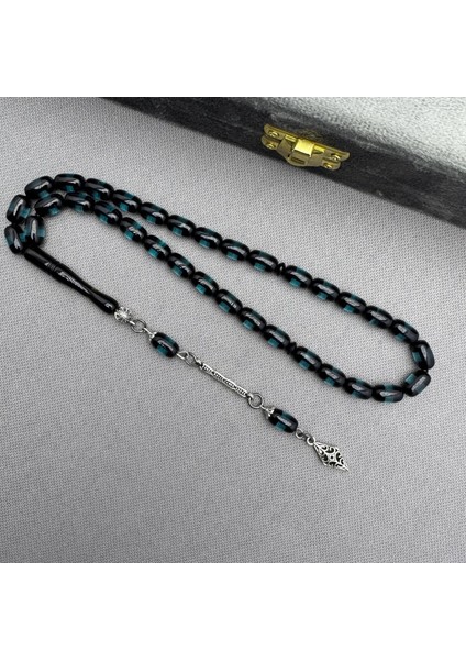 Alpaka Püsküllü Petrol Yeşil Şeffaf Renk Sürmeli Model Sıkma Kehribar Tespih