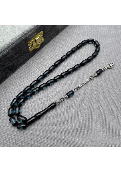 Alpaka Püsküllü Petrol Yeşil Şeffaf Renk Sürmeli Model Sıkma Kehribar Tespih