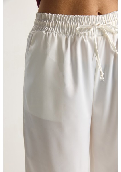 Kadın Yüksek Bel Beli Lastikli Saten Bol Paça Pantolon