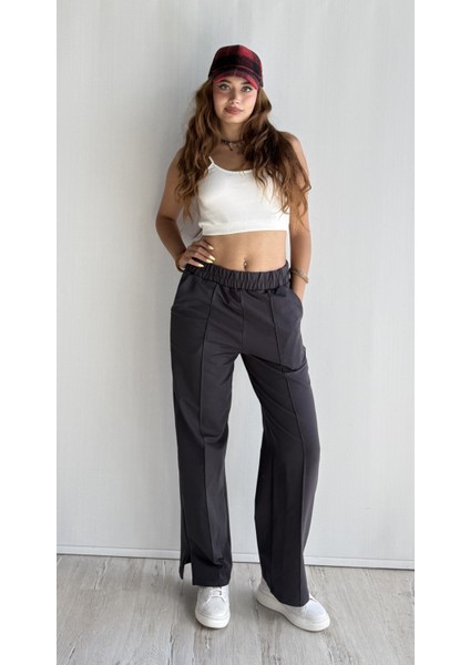 Kadın Lastikli Yüksek Bel Yırtmaçlı Bol Paça Pantolon indirimleri