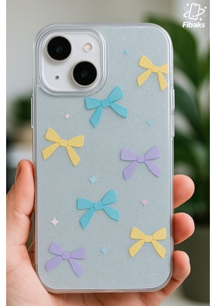 Apple iPhone 13/14 Uyumlu Kılıf Mavi Simli Renkli Fiyonk Desenli Parlak Darbe Emici Kapak fiyatları