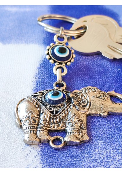 Metal Fil Şekilli Üzeri Cam Göz Süslemeli Ince Işlemeli Anahtarlık indirimleri