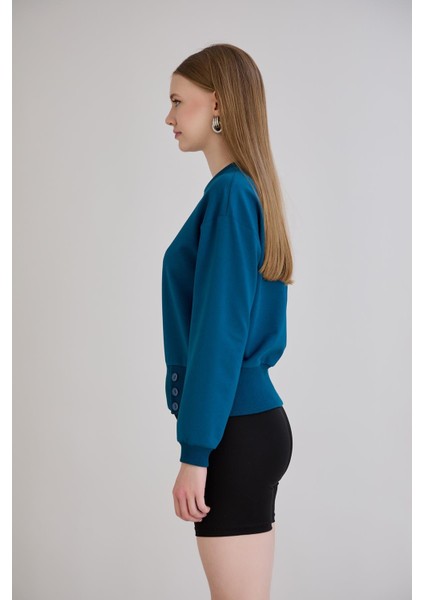 Eteği Üç Düğmeli ve Kaşkorseli Bisiklet Yaka Sweatshirt Petrol indirimleri