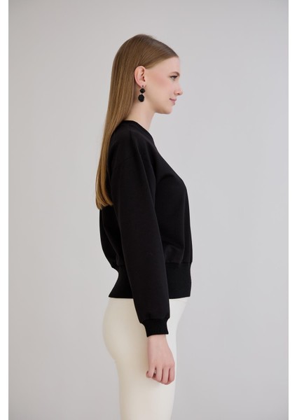 Eteği Üç Düğmeli ve Kaşkorseli Bisiklet Yaka Sweatshirt Siyah indirimleri